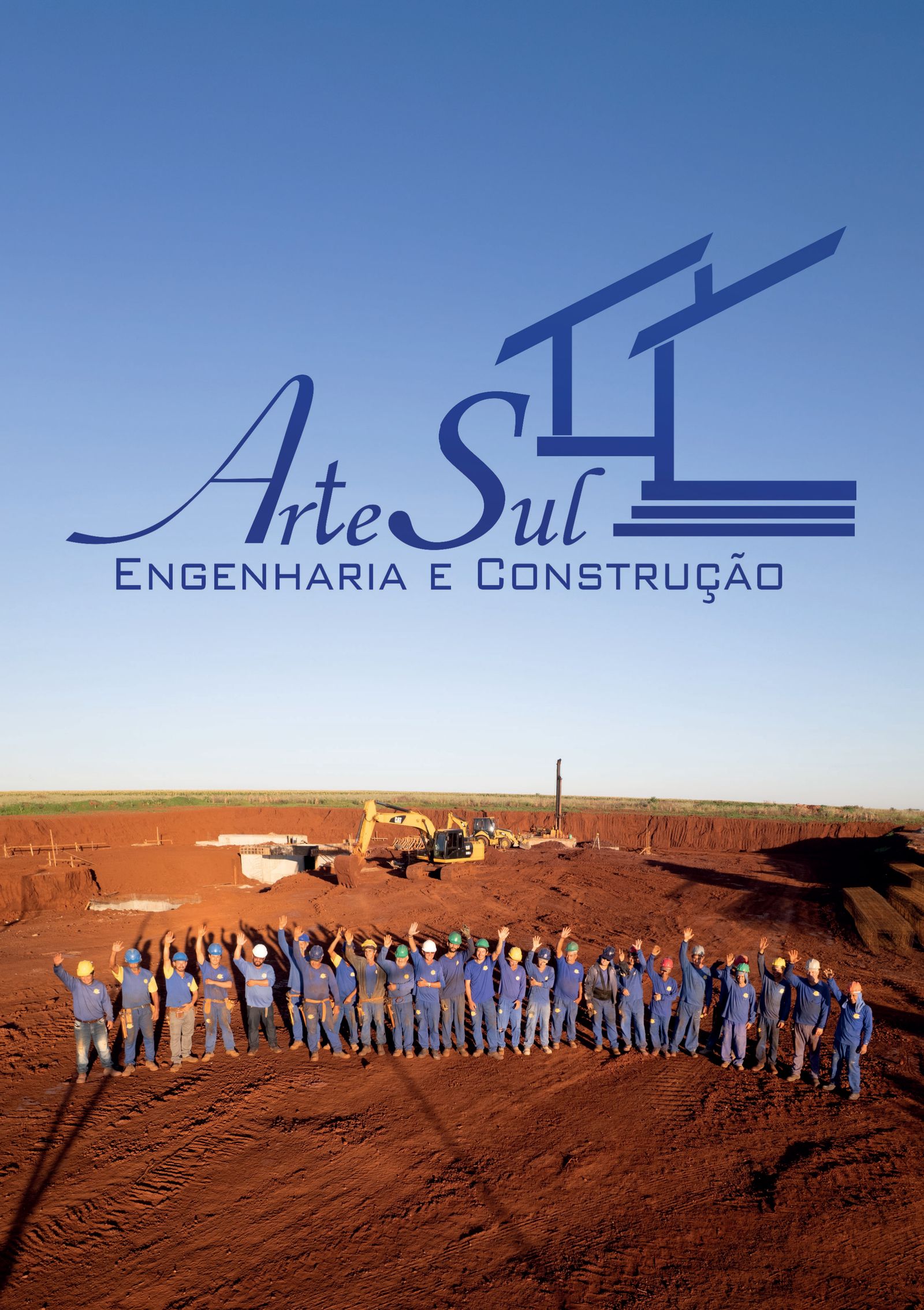 Equipe da Arte Sul reunida em obra de terraplenagem, com o logo da empresa no céu